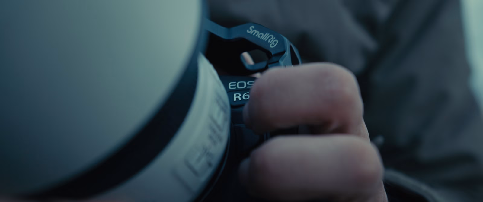 a close up of a person holding a camera